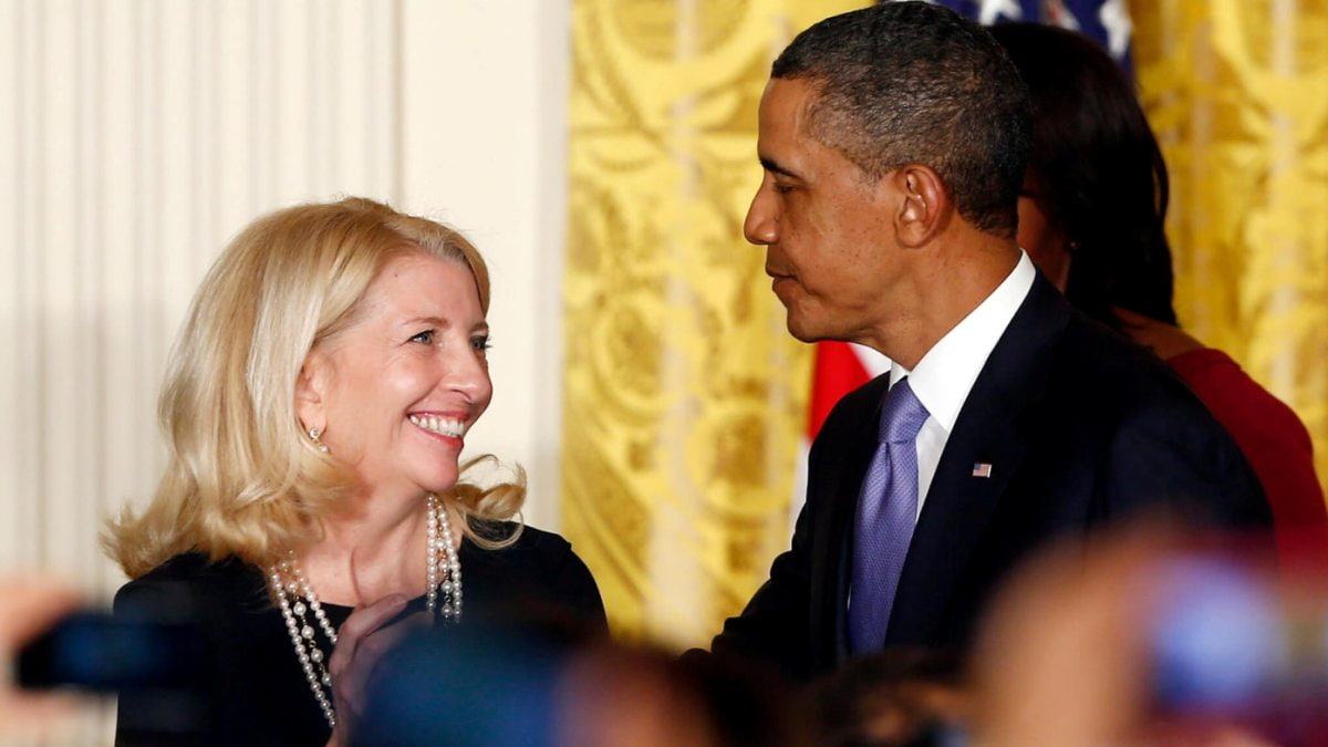 Catherine Russell junto a Obama. 