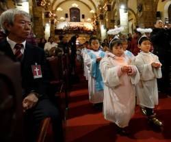 Niños en misa en una parroquia oficial -no clandestina- de Pekín, donde hay algo más de libertad que en otras regiones chinas