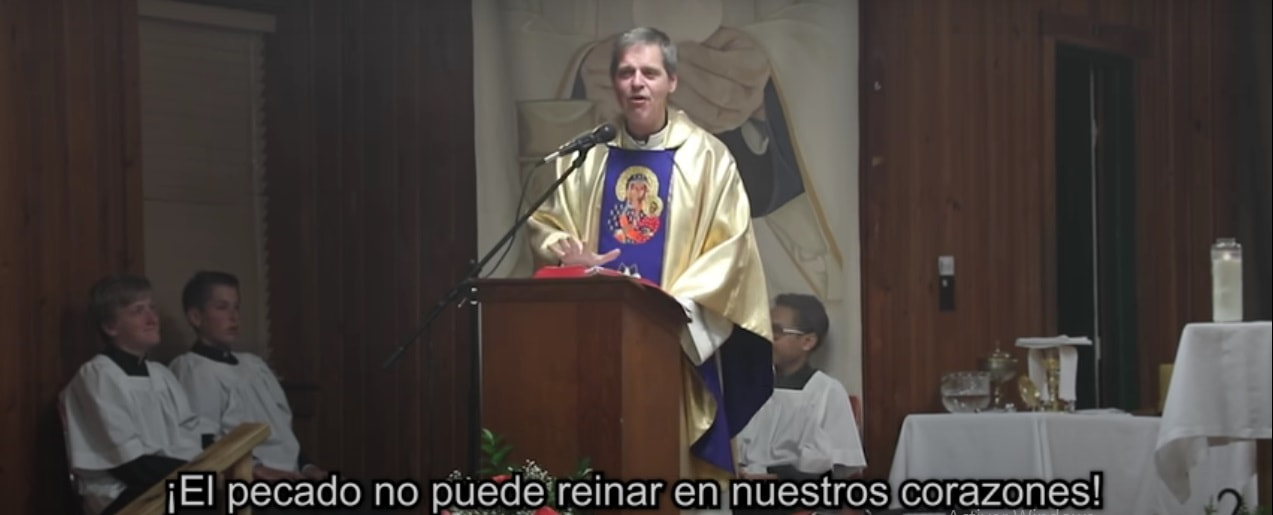 El padre Henry predica en un retiro de Pascua