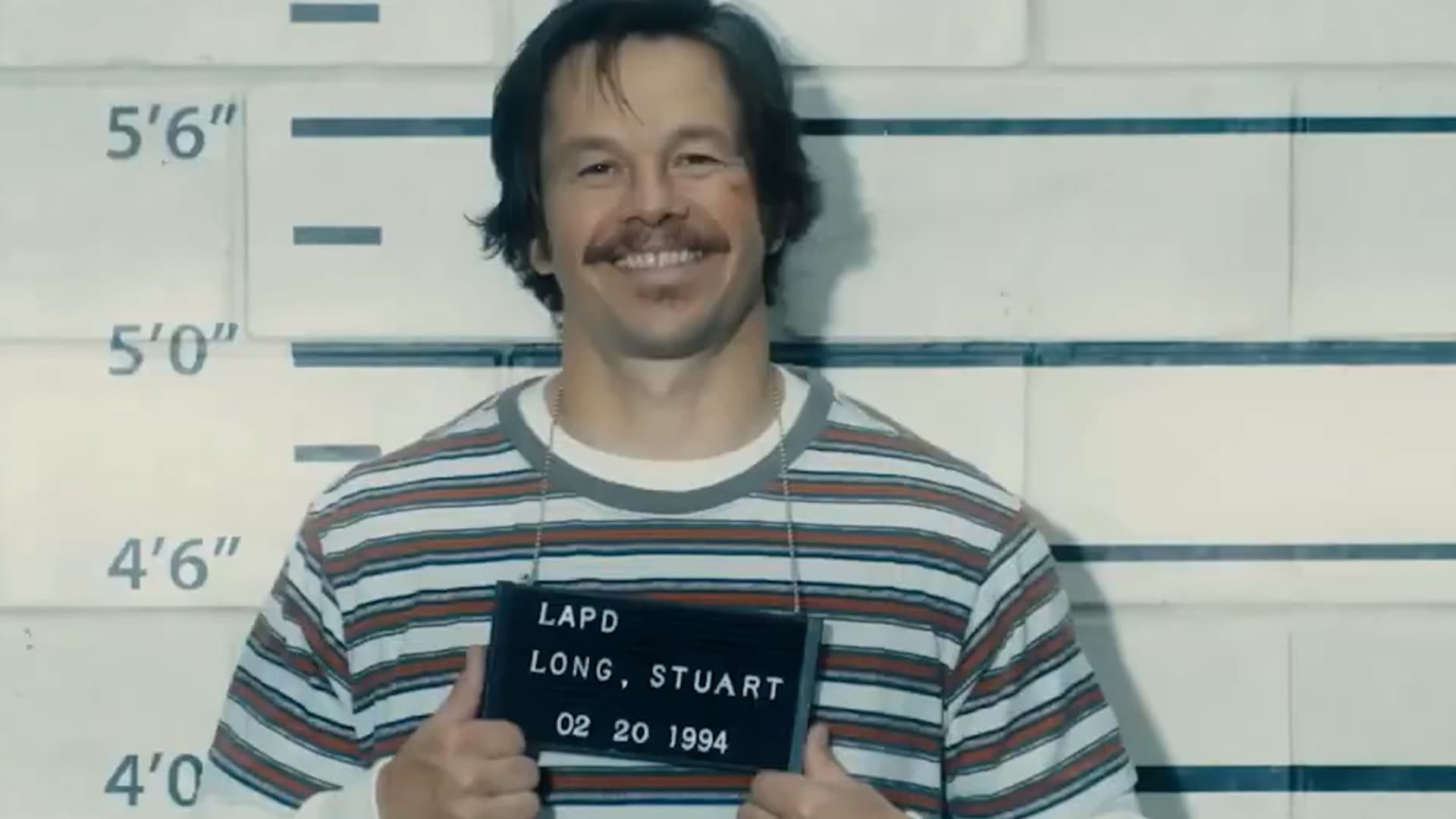 Mark Wahlberg as Stu Long during his time with the police