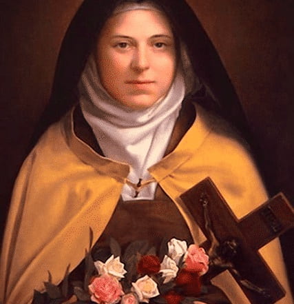 Santa Teresita de Lisieux con rosas, signo de las gracias que iba a otorgar desde el Cielo tras su muerte
