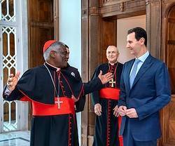 El cardenal Turkson conversa con el presidente sirio Bashar al-Assad.