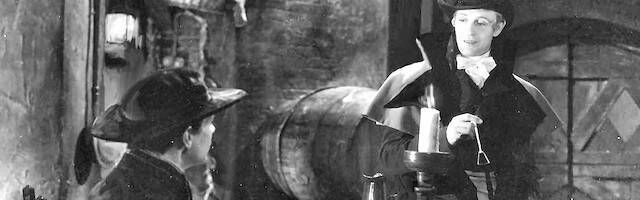 Leslie Howard como la Pimpinela Escarlata.